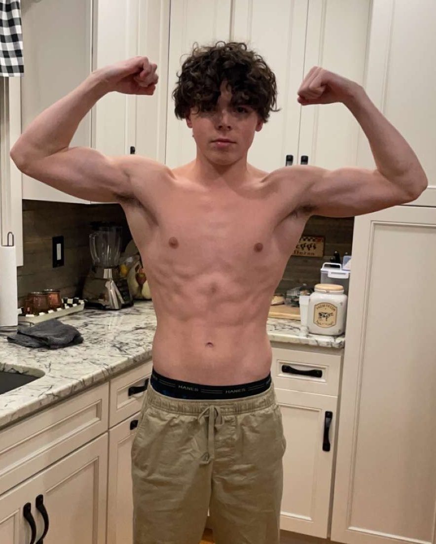 Ben flexing both arms when he first started lifting
